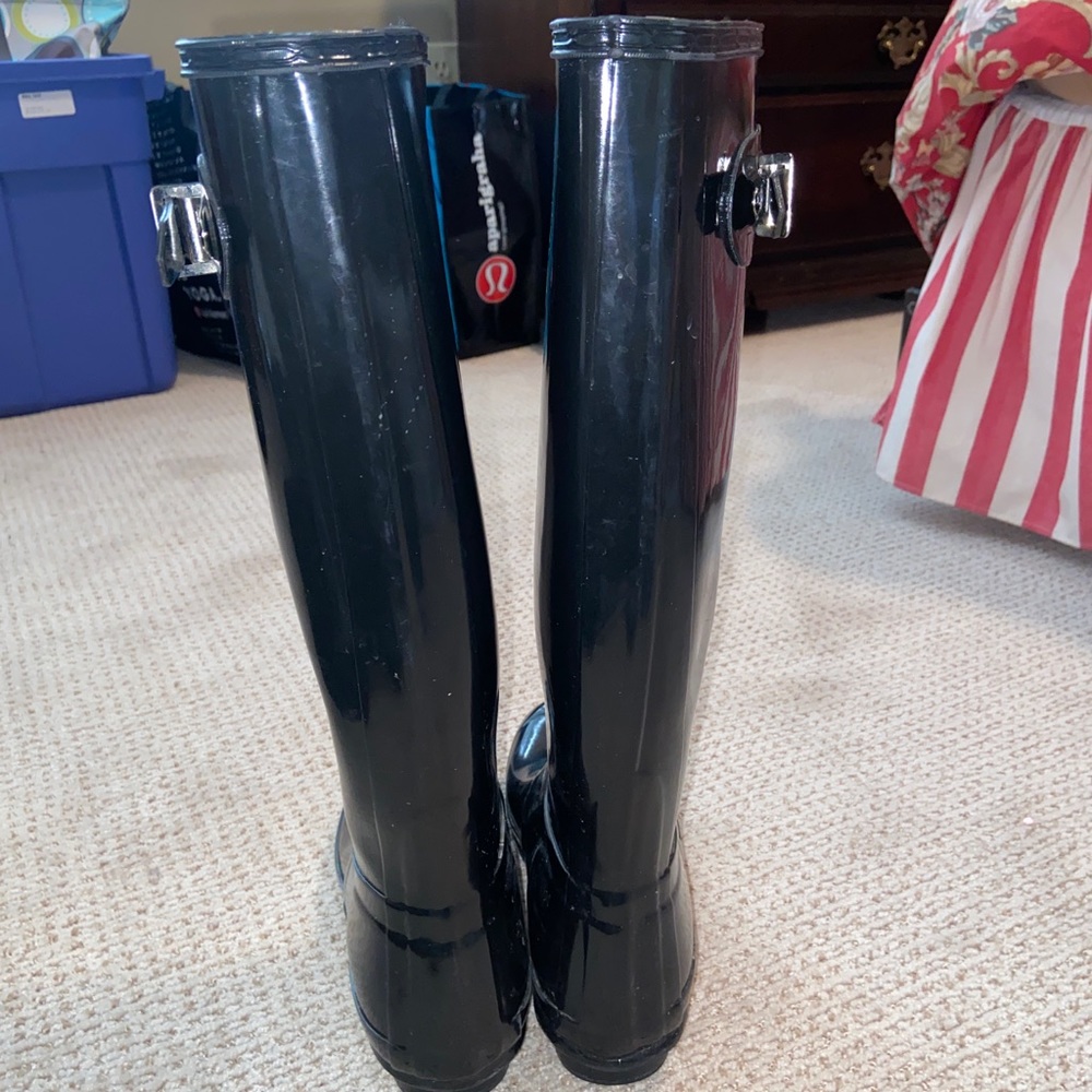 black tall hunter boots